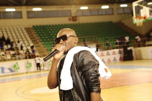 Kennis Music artiste, JoEL Amadi serenades the audience at the DStv Premier Basketball league All Star game in Abuja.