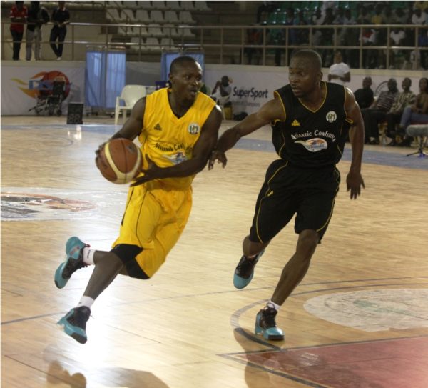 Basketball action going down on the court between the Savannah Conference and the Atlantic Conference.