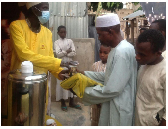 A muslim faithful being handed his refreshment at the lipton ramadan lounge in Bauchi State