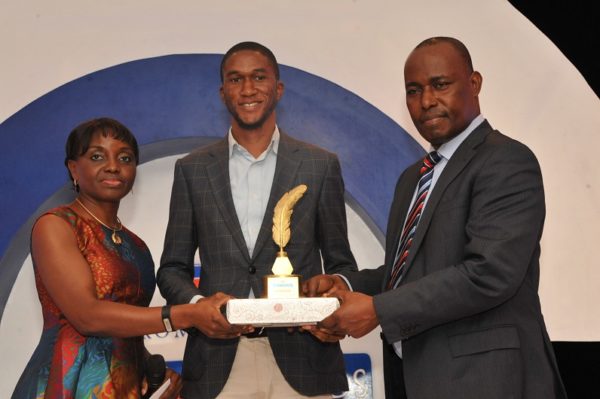 Tobi Aworinde, winner, Education Reporter of the Year (m); receiving his award from Judy Okolo, Senior Manager, Promasidor Nigeria Limited (l); and Martins Oloja, former Editor/member Editorial Board, Guardian newspapers; at the 2016 Promasidor Quill Awards event held at Sheraton Lagos Hotel …recently