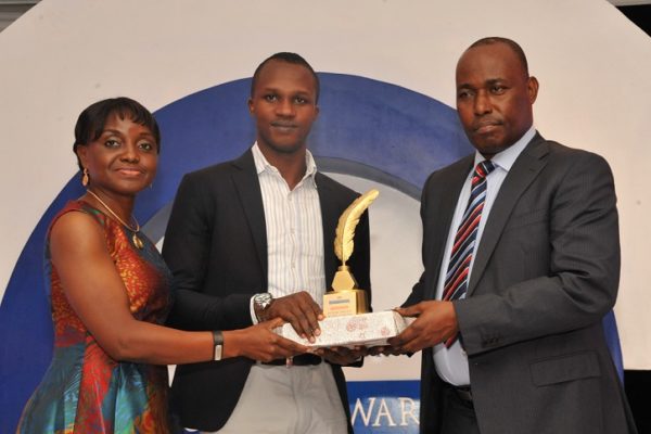 Tunde Ajaja, winner, Future Writer of the Year (m); receiving his award from Judy Okolo, Senior Manager, Promasidor Nigeria Limited (l); and Martins Oloja, former Editor/member Editorial Board, Guardian newspapers; at the 2016 Promasidor Quill Awards event held at Sheraton Lagos Hotel …recently