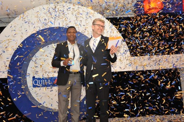 Ajibola Amzat, overall winner; receiving his award from Olivier Thiry, Managing Director, Promasidor Nigeria Limited; at the 2016 Promasidor Quill Awards event held at Sheraton Lagos Hotel …recently