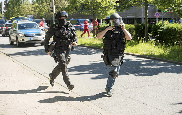 VIERNHEIM, GERMANY - JUNE 23: Heavily-armed police outside a movie theatre complex where an armed man has reportedly opened fire on June 23, 2016 in Viernheim, Germany. According to initial media reports, the man entered the cinema today at approximately 3pm, fired a shot in the air and barricaded himself inside. (Photo by Alexander Scheuber/Getty Images)