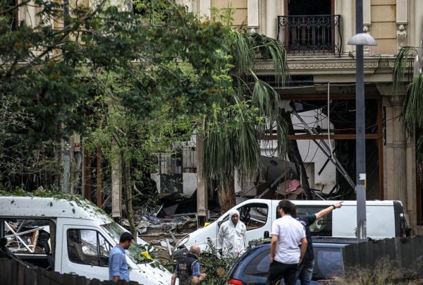 ISTANBUL, TURKEY - JUNE 7: Police officers secure the area near to the scene of a bomb attack which targeted a police bus in the Vezneciler district on June 7, 2016 in Istanbul, Turkey. At least 7 police officers and 4 civilians were killed with a further 36 people wounded after an explosion, believed to have been caused by a bomb, targeted a police bus in central Istanbul according to Istanbul governor Vasip Sahin.