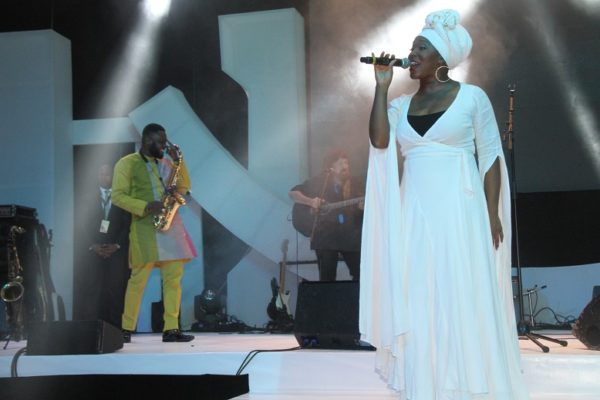 India Arie and Mike Aremu on stage