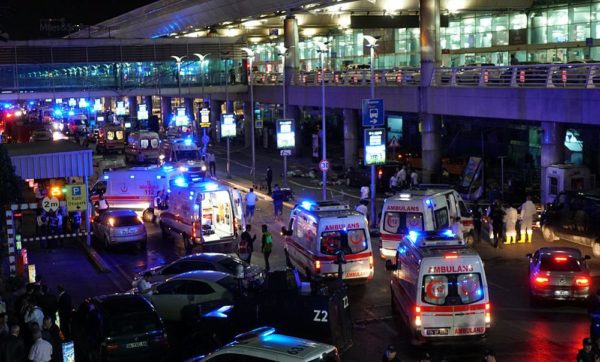 ISTANBUL, TURKEY - JUNE 28: Security and ambulances block the road outside Turkey's largest airport, Istanbul Ataturk, after it was hit by a suicide bomb attack on June 28, 2016, Turkey. Two suicide bombers opened fire before blowing themselves up at the entrance to the main international airport in Istanbul, killing at least 10 people and wounding at least 60 people according to Justice Minister Bekir Bozdagç. (Photo by Mehmet Ali Poyraz/Getty Images)