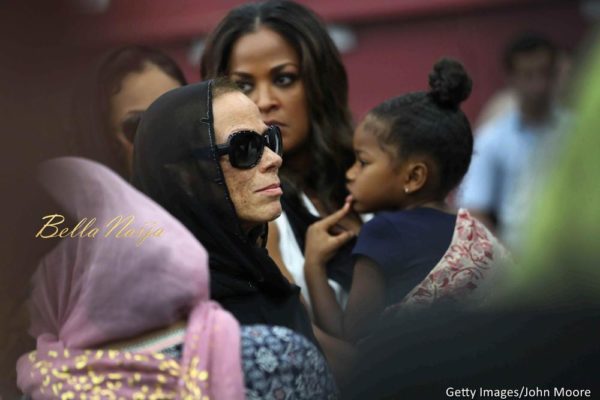 Muhammad Ali's fourth wife Lonnie Ali (L), stands with Ali's daughter Laila Ali and a grandchild during an Islamic prayer service at the Kentucky Exposition Center on June 9, 2016 in Louisville, Kentucky.