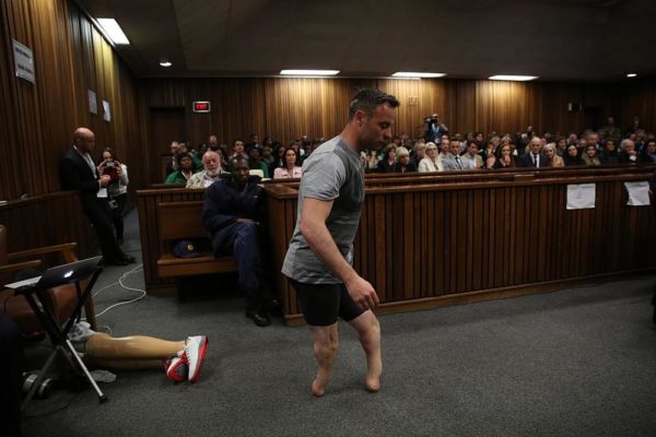 PRETORIA, SOUTH AFRICA - JUNE 15:  Oscar Pistorius walks across the courtroom without his prosthetic legs during the third day of Oscar's hearing for a resentence at Pretoria High Court on June 15, 2016 in Pretoria, South Africa. Having had his conviction upgraded to murder in December 2015, Paralympian athlete Oscar Pistorius is attending his sentencing hearing and will be returned to jail for the murder of his girlfriend, Reeva Steenkamp, on February 14th 2013. The hearing is expected to last five days. (Photo by Siphiwe Sibeko - Pool/Getty Images)