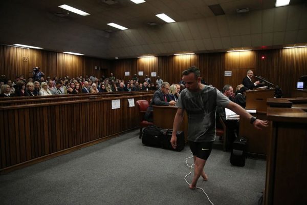 PRETORIA, SOUTH AFRICA - JUNE 15:  Oscar Pistorius walks across the courtroom without his prosthetic legs during the third day of Oscar's hearing for a resentence at Pretoria High Court on June 15, 2016 in Pretoria, South Africa. Having had his conviction upgraded to murder in December 2015, Paralympian athlete Oscar Pistorius is attending his sentencing hearing and will be returned to jail for the murder of his girlfriend, Reeva Steenkamp, on February 14th 2013. The hearing is expected to last five days. (Photo by Siphiwe Sibeko - Pool/Getty Images)