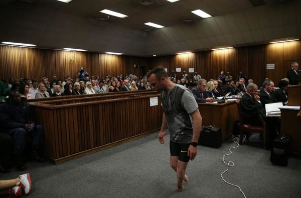 PRETORIA, SOUTH AFRICA - JUNE 15:  Oscar Pistorius walks across the courtroom without his prosthetic legs during the third day of Oscar's hearing for a resentence at Pretoria High Court on June 15, 2016 in Pretoria, South Africa. Having had his conviction upgraded to murder in December 2015, Paralympian athlete Oscar Pistorius is attending his sentencing hearing and will be returned to jail for the murder of his girlfriend, Reeva Steenkamp, on February 14th 2013. The hearing is expected to last five days. (Photo by Siphiwe Sibeko - Pool/Getty Images)