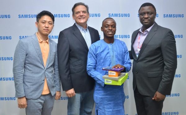 L-R: Manager, Product Marketing, Mr. Chaejin Im; Director & Business Leader, Information Technology and Mobile, Mr. Emmanouil Revmatas, both of Samsung Electronics West Africa; Winner, Samsung “Inspire Bigger Dreams” contest, Muhammed Musa, and Director, Information Technology and Mobile, Samsung Electronics West Africa, Mr. Olumide Ojo during the presentation of Samsung mobile devices and accessories to winners of its just concluded campaign at Samsung Offices, VI