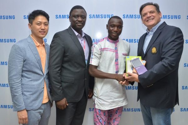 L-R: Manager, Product Marketing, Chaejin Im; Director, Information Technology & Mobile, Mr. Olumide Ojo, both of Samsung Electronics West Africa; Winner, Samsung “Inspire Bigger Dreams” contest, Ibrahim Ambali; and Director & Business Leader, Information Technology and Mobile, Samsung Electronics West Africa, Mr. Emmanouil Revmatas during the presentation of Samsung mobile devices and accessories to winners of its just concluded campaign at Samsung Offices, VI