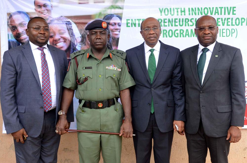 R-L : Heritage Bank Managing Director/CEO Ifie Sekibo; the Central Bank Governor Godwin Emefiele; Director-General of National Youth Service Corps (NYSC), Brig-Gen Sule Kazaure and CBN Deputy Governor Adebayo Adekola Adelabu at the official flag off of the N3billion Youth Innovative Entrepreneurship Development Programme (YIEDP) training for selected candidates at the NYSC Village, Kubwa, Abuja in which Heritage Bank is the pilot partner bank.