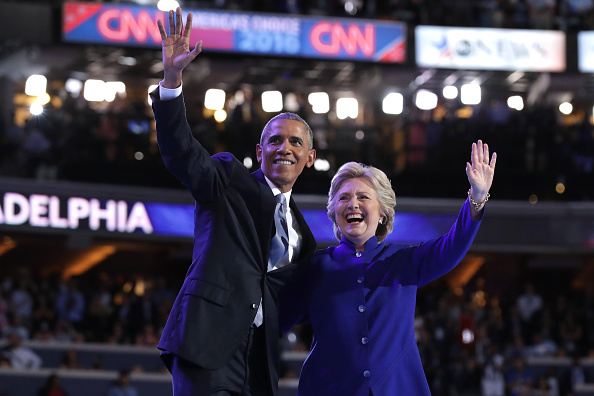 PHILADELPHIA, PA - JULY 27: US President Barack Obama and Democratic Presidential nominee Hillary Clinton wave to the crowd on the third day of the Democratic National Convention at the Wells Fargo Center, July 27, 2016 in Philadelphia, Pennsylvania. Democratic presidential candidate Hillary Clinton received the number of votes needed to secure the party's nomination. An estimated 50,000 people are expected in Philadelphia, including hundreds of protesters and members of the media. The four-day Democratic National Convention kicked off July 25. (Photo by Chip Somodevilla/Getty Images)