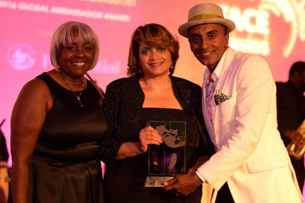 Gale Britton (L) and Dorinda Walker (R) presented the 2016 Global Ambassador Award to Marcus Samuelsson on behalf of Prudential