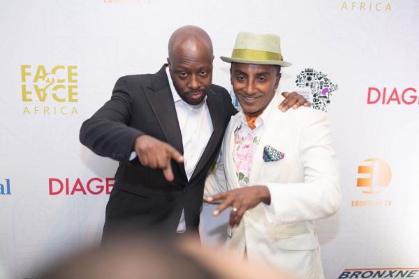 Honorees Wyclef Jean and Marcus Samuelsson share a special moment on the red-carpet