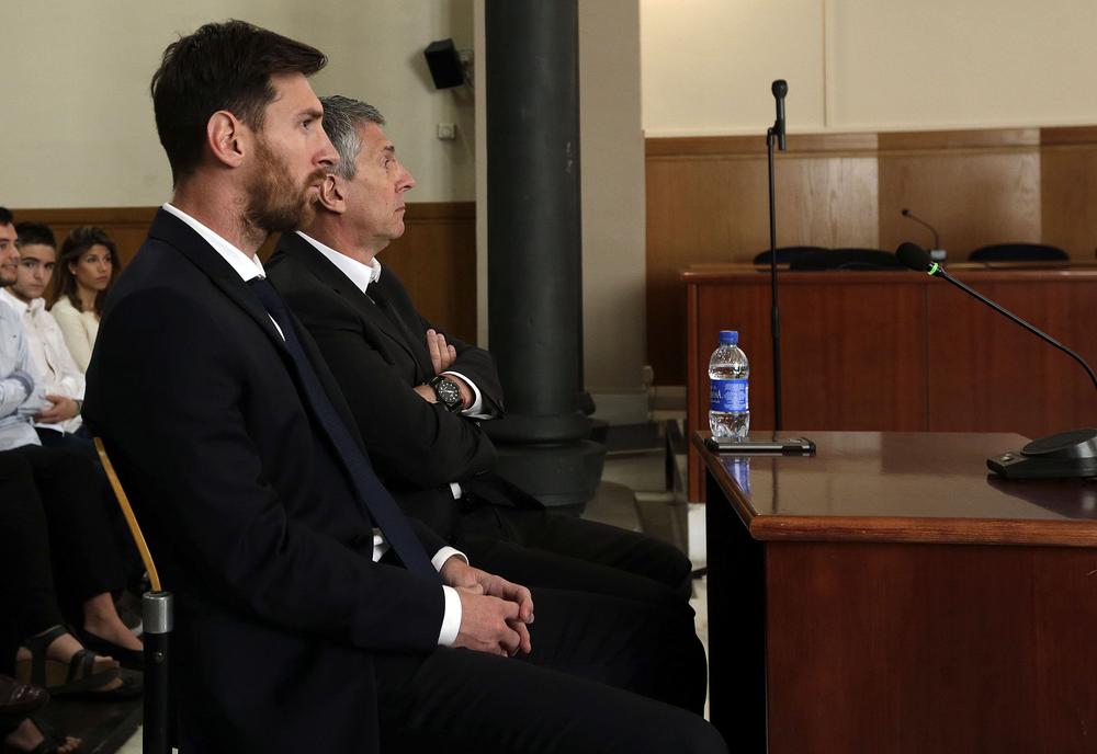 BARCELONA, SPAIN - JUNE 02: Lionel Messi of FC Barcelona and his father Jorge Horacio Messi seen inside the court during the third day of the trial on June 2, 2016 in Barcelona, Spain. Lionel Messi and his father Jorge Messi, who manages his financial affairs, are accused of defrauding the Spanish Tax Agency of 4.1 million Euros ($4.6 million, £3.2 million) by using companies based in tax havens such as Belize and Uruguay to conceal earnings from image rights during years 2007 to 2009. (Photo by Alberto Estevez - Pool/Getty Images)