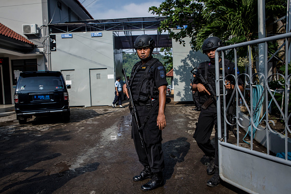 CILACAP, CENTRAL JAVA, INDONESIA - JULY 28: Indonesian police stand guard at Wijayapura port, the entrance gate to Nusakambangan prison, ahead of a third round of drug executions on July 28, 2016 in Cilacap, Central Java, Indonesia. According to reports, Indonesia is likely to resume executions of 14 prisoners on death row this week. Fourteen prisoners, including inmates from from Nigeria, Pakistan, India, South Africa, and four Indonesians, have been moved to isolation holding cells at Nusa Kambangan, off Central Java. (Photo by Ulet Ifansasti/Getty Images)