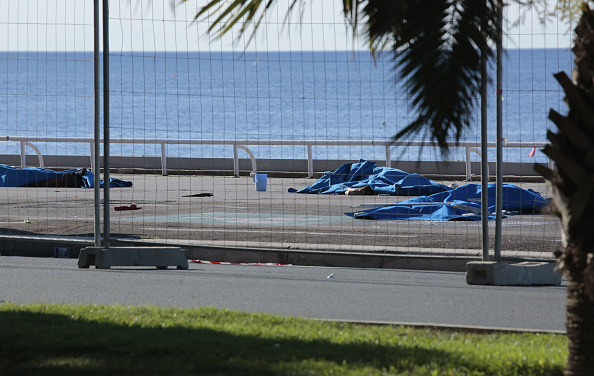 NICE, FRANCE - JULY 15: Dead body covered after the attack on the Promenade des Anglais on July 15, 2016 in Nice, France.An attack in Nice where a man rammed a truck into a crowd of people left 84 dead. (Photo by Patrick Aventurier/Getty Images)