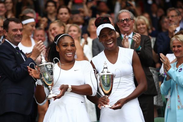 LONDON, ENGLAND - JULY 09: Venus Williams of The United States and Serena Williams of The United States celebrate victory in the Ladies Doubles Final against Timea Babos of Hungary and Yaroslava Shvedova of Kazakhstan on day twelve of the Wimbledon Lawn Tennis Championships at the All England Lawn Tennis and Croquet Club on July 9, 2016 in London, England. 