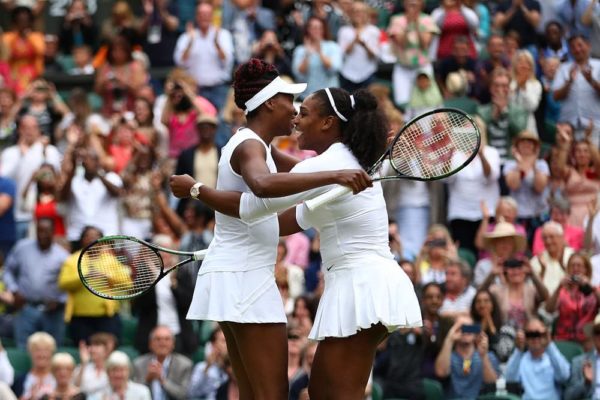 LONDON, ENGLAND - JULY 09: Venus Williams of The United States and Serena Williams of The United States celebrate victory in the Ladies Doubles Final against Timea Babos of Hungary and Yaroslava Shvedova of Kazakhstan on day twelve of the Wimbledon Lawn Tennis Championships at the All England Lawn Tennis and Croquet Club on July 9, 2016 in London, England. (Photo by Clive Brunskill/Getty Images)