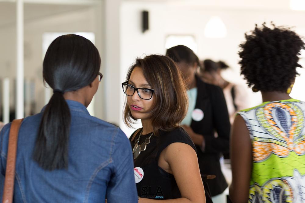 Speaker Hilda Moraa networking with participants