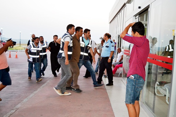 BALIKESIR, TURKEY - JULY 16: Two detained soldiers, Dean of the Istanbul Air force academy Colonel Ahmet Gumus and Colonel Pilot Murat Karakus, involved in "Parallel State/Gulenist Terrorist Organization"s coup attempt, are being escorted by Police officers in Ayvalik district of Balikesir in Turkey on July 16, 2016 as they set to escape to Lesbos island of Greece. (Photo by Suat Salgin/Anadolu Agency/Getty Images)