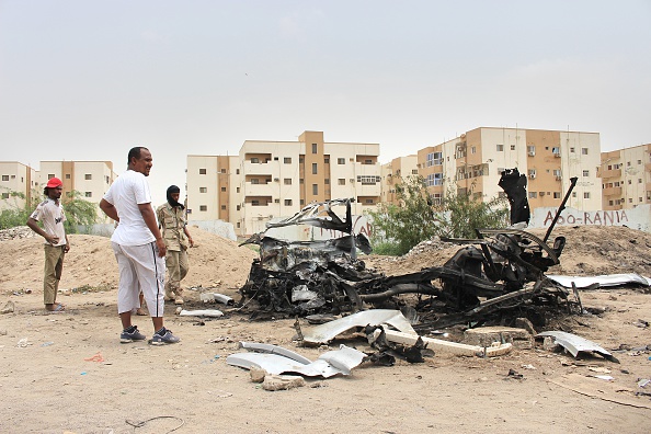 ADEN, YEMEN - JULY 15: Yemenis inspect wreckage of a vehicle following a suicide car bombing that targeted Yemen's port city Aden's governor Aidarus al-Zubaid, in Aden, Yemen on July 15, 2016. (Photo by Wail Shaif Thabet/Anadolu Agency/Getty Images)