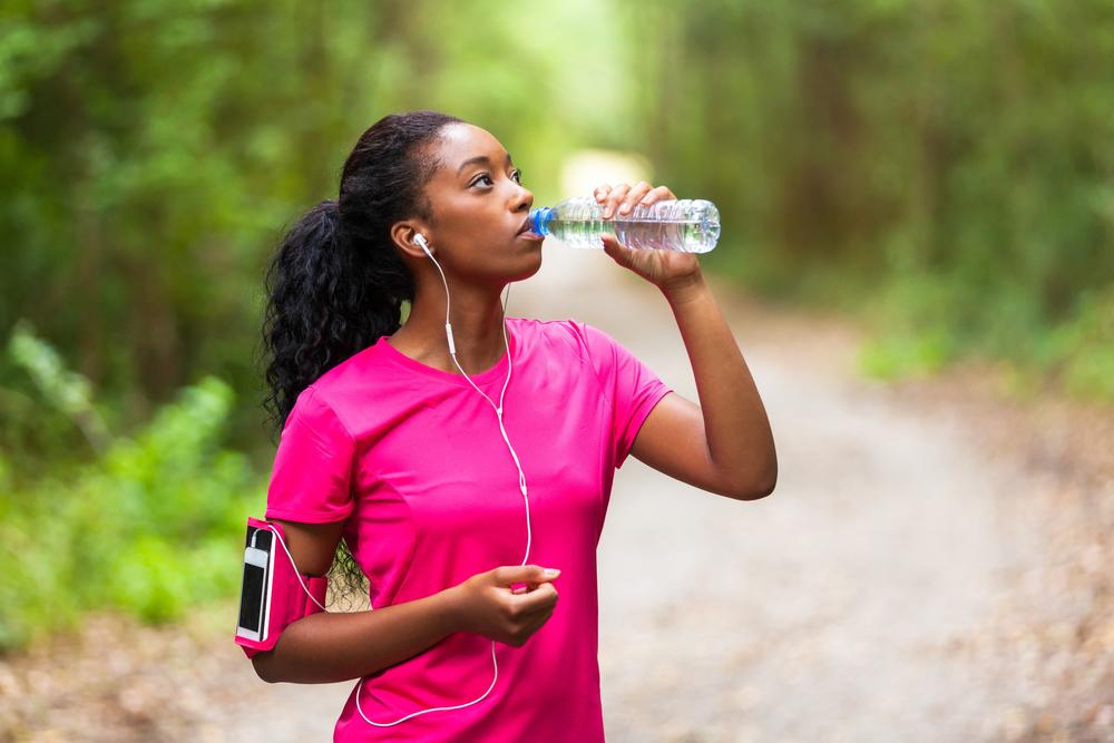 black woman working out exercise drinking water dreamstime