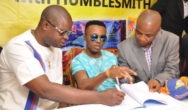 Chief Ogo Emenike,Managing Director,Tummy Tummy Foods Industries Limited;Ijemba Ekenedilichukwu[Humblesmith]Brand Ambassador and Mr. Chijioke Anumoka,General Manager,Tummy Tummy Foods Industries Limited.At the Unveiling of Humble smith as Brand Ambassador of Tummy Tummy Foods Industries Limited in Lagos yesterday.