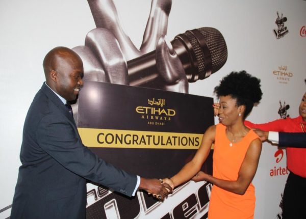 (L-R) George Mawadri, Etihad Airways’ General Manager, Nigeria, presents Agharese Emokpae, winner of the first season of The Voice Nigeria, with her tickets to Abu Dhabi by Etihad Airways recently