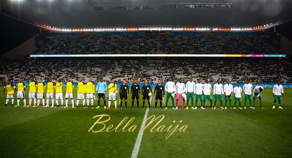 SAO PAULO, BRAZIL - AUGUST 10: Players of Nigeria and Colombia stand for the national anthen before the match between Colombia and Nigeria mens football for the Olympic Games Rio 2016 at Arena Corinthians on August 10, 2016 in Sao Paulo, Brazil. (Photo by Alexandre Schneider/Getty Images)