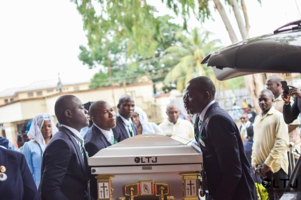 Day 1 E - Casket is taken out of the hearse