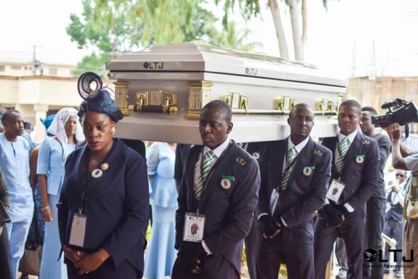 Day 1 F - Casket being carried into church