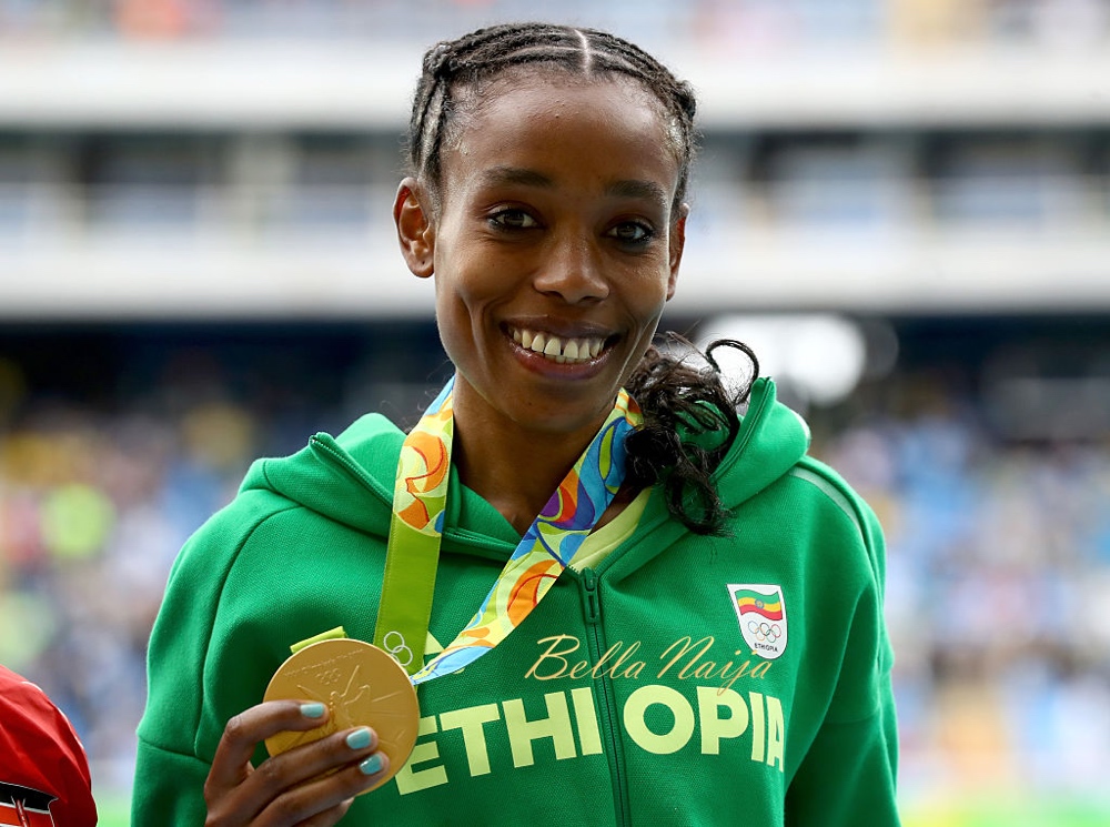 RIO DE JANEIRO, BRAZIL - AUGUST 12: Almaz Ayana of Ethiopia poses with the gold medal for the Women's 10,000 Meters Final after setting a new world record of 29:17.45 on Day 7 of the Rio 2016 Olympic Games at the Olympic Stadium on August 12, 2016 in Rio de Janeiro, Brazil. (Photo by Alexander Hassenstein/Getty Images)