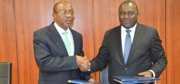 Incoming President, Godwin Emefiele (left), a outgoing President, Lucas A. Nchama (right).