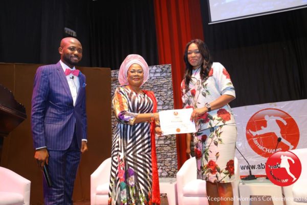 Patricia Obozuwa receiving The Xceptional Women's Role Model Award