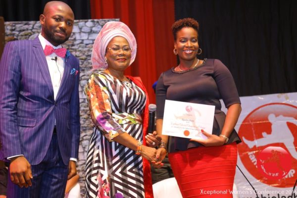 Ugochi Okere receiving The Xceptional Women's Role Model Award