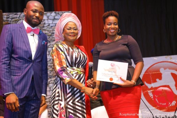 Ugochi Okere receiving The Xceptional Women's Role Model Award