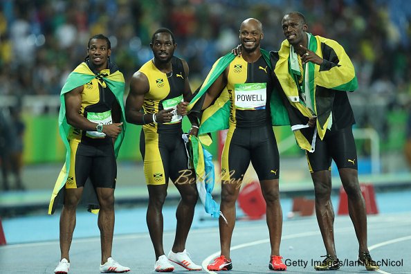 RIO DE JANEIRO, BRAZIL - AUGUST 19: Usain Bolt of Jamaica celebrates with teammates Asafa Powell, Yohan Blake and Nickel Ashmeade after winning the Men's 4 x 100m Relay Final on Day 14 of the Rio 2016 Olympic Games at the Olympic Stadium on August 19, 2016 in Rio de Janeiro, Brazil. (Photo by Ian MacNicol/Getty Images)