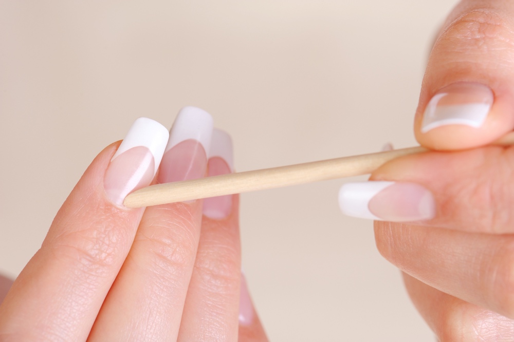 Premium Photo | Closeup of a woman cutting nails, health care concept