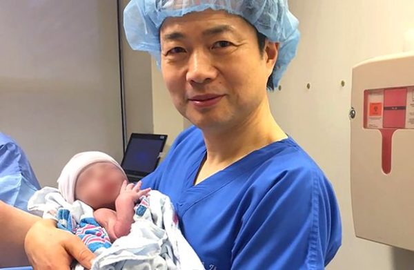 Dr. John Zhang and Little Abrahim Hassan