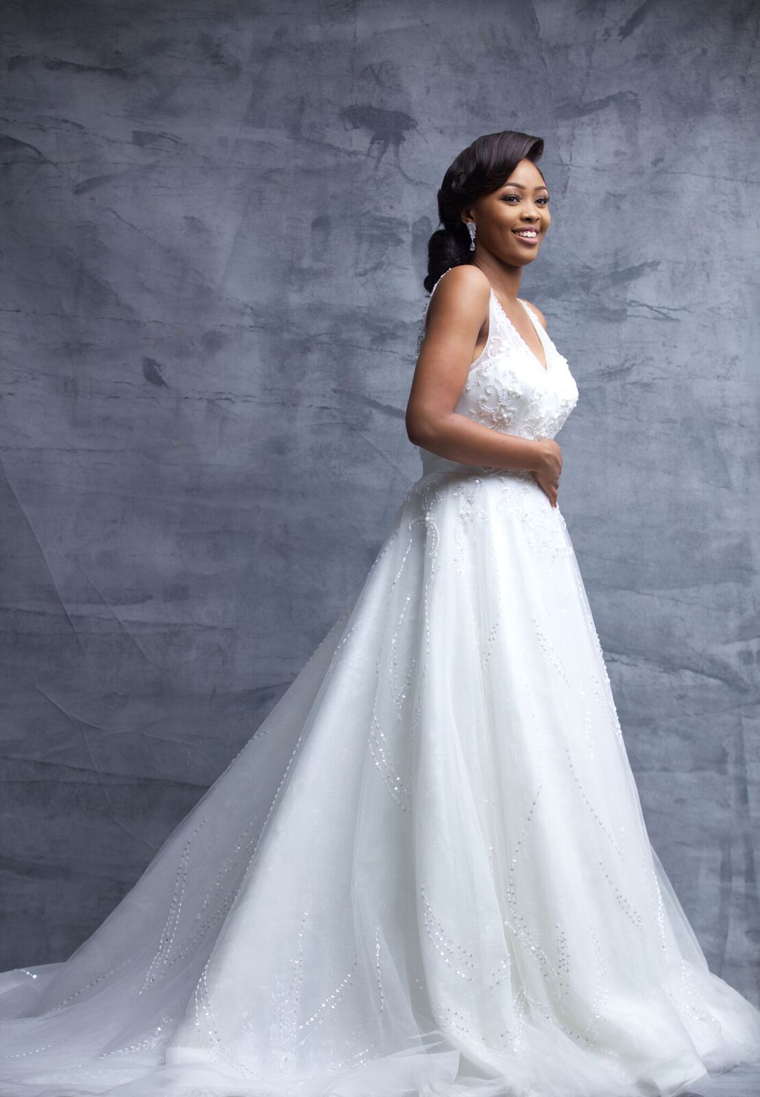 Lindsey: She's a daring modern day princess, she's fun, flirty and loves all things romance. She sparkles at every turn as her dress very embellished.