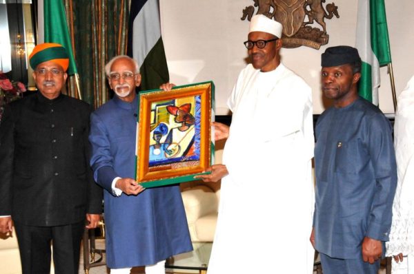 PIC.3. PRESIDENT MUHAMMADU BUHARI (2ND R), PRESENTING A SOUVENIR TO THE VISITING VICE PRESIDENT OF INDIA, MR MOHAMMAD HAMID ANSARI (2ND L), AT THE PRESIDENTIALVILLA IN ABUJA ON TUESDAY (27/9/16). WITH THEM ARE: VICE-PRESIDENT YEMI OSINBAJO (R) AND INDIAN MINISTER OF STATE FOR FINANCE, MR GANGARAM MEGHWAL. 7136/27/9/2016/ CALLISTUS EWELIKE/DKO/BJO/NAN