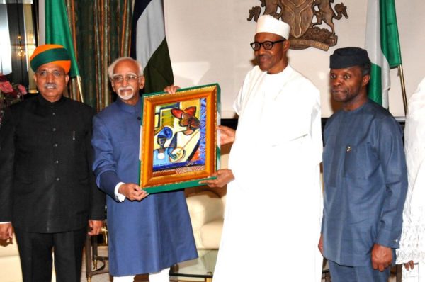 PIC.3. PRESIDENT MUHAMMADU BUHARI (2ND R), PRESENTING A SOUVENIR TO THE VISITING VICE PRESIDENT OF INDIA, MR MOHAMMAD HAMID ANSARI (2ND L), AT THE PRESIDENTIALVILLA IN ABUJA ON TUESDAY (27/9/16). WITH THEM ARE: VICE-PRESIDENT YEMI OSINBAJO (R) AND INDIAN MINISTER OF STATE FOR FINANCE, MR GANGARAM MEGHWAL.  7136/27/9/2016/ CALLISTUS EWELIKE/DKO/BJO/NAN