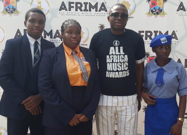 R:L Winner, Emaka Omo-Lamai, Dowen College; 1st Runner-up, Eze Okoli, Vivian Fowler School; Country Director Nigeria, AFRIMA, Kingsley James and The 2nd Runner up, Aunty Ayo Girls Senior Secondary School at the 2016 Felabration School debate in Lagos..on Wednesday