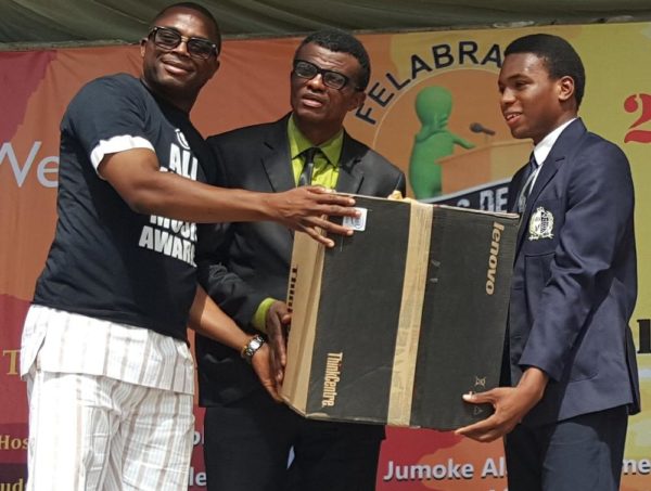 Country Director Nigeria, AFRIMA, Mr. Kingsley James Presenting a Desktop Computers to the Winner, 2016 Felabration School Debate, Emaka Omo-Lamai (L) and Mr. Kono-Ugen Kono (Middle) of Dowen College During the Presentation of Prize to the Winner