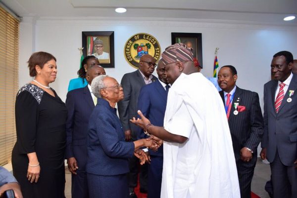 Ambode shaking hands with Margaret Rose Adetutu Adeleke during a courtesy visit to the Governor