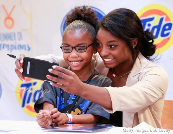 HOUSTON, TX - SEPTEMBER 30: Olympic gold medal-winning gymnast Simone Biles meets with fans in her home town at Kroger on September 30, 2016 in Houston, Texas. (Photo by Bob Levey/Getty Images)