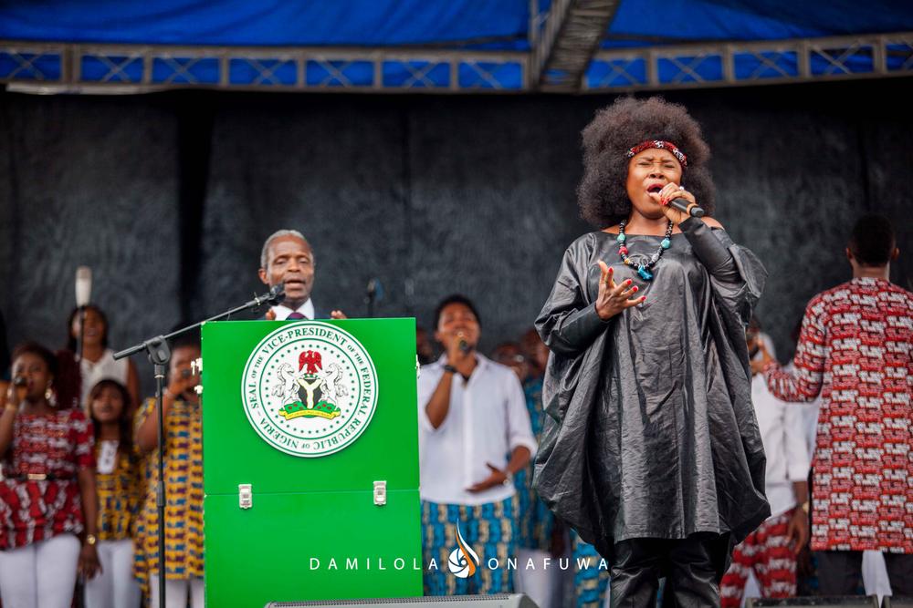 The Vice President, Professor Yemi Osinbajo and Omawumi recite the National Anthem